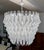 A magnificent and highly decorative chandelier produced in Murano, Italy, during the 2000s. This impressive lighting piece...