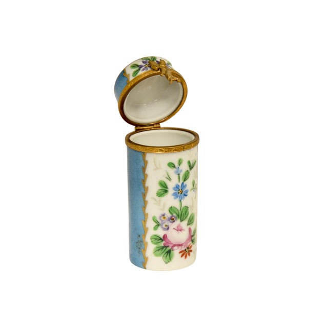 Vintage Limoges of France trinket accent box designed as a tall cylinder with panels of aqua blue alternating with...