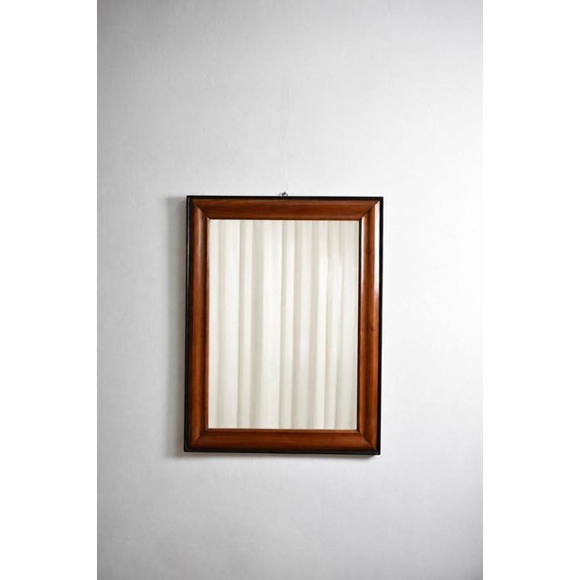 Pair of bicolor wood and ebonised wood mirrors, XIXth c. Height: 109 cm - 42.91 in Length: 84 cm - 33.07 in Width: 3 cm -...