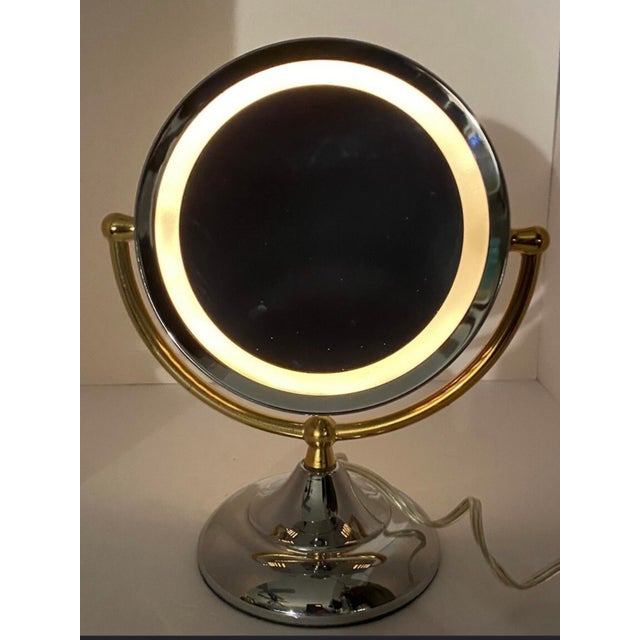 Vintage Brass & Chrome Lighted Makeup Mirror, Serial# on the underside. Designer vintage About A beautifully designed...