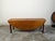 An English walnut drop leaf table from the 19th century, with oval top and straight legs. Created in England during the...
