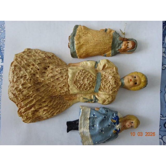 Vintage handcrafted ceramic Victorian woman and 2 young girls figurines used as Christmas ornaments. Hand painted with...