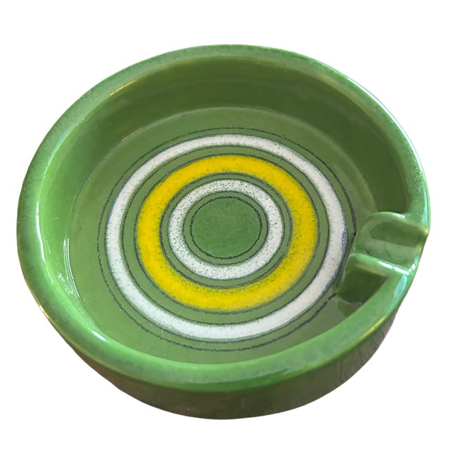 The pair consists of a cylindrical vase and single cigarette ashtray in green from the Fusie Colorate series. Designed by...