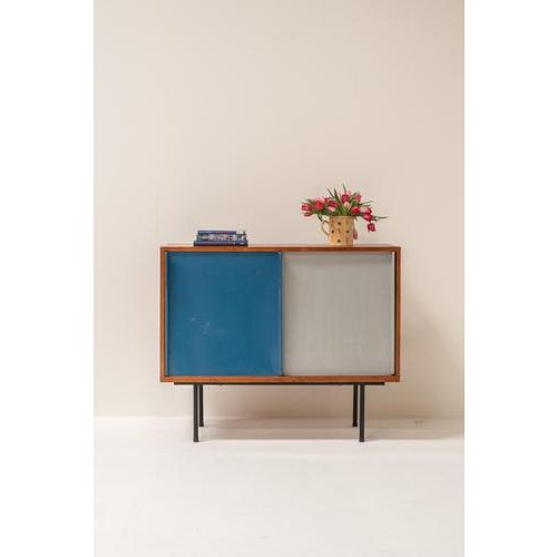 Unique French cabinet from the 1950s, defined by a beautiful balance between functionality and playful design. The warm...