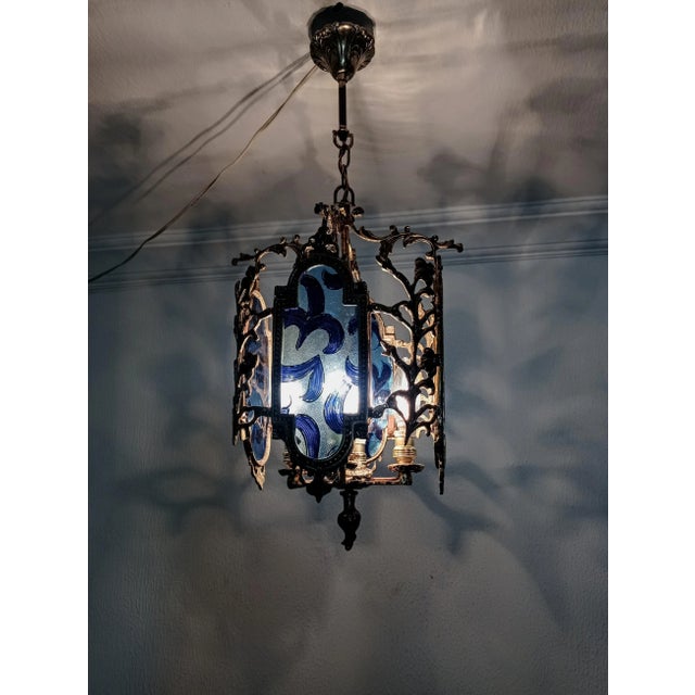 Lighting capacity depend on your preferred lamps. Stained Glass Style Blue Colored Chandelier Renewed all cables and...