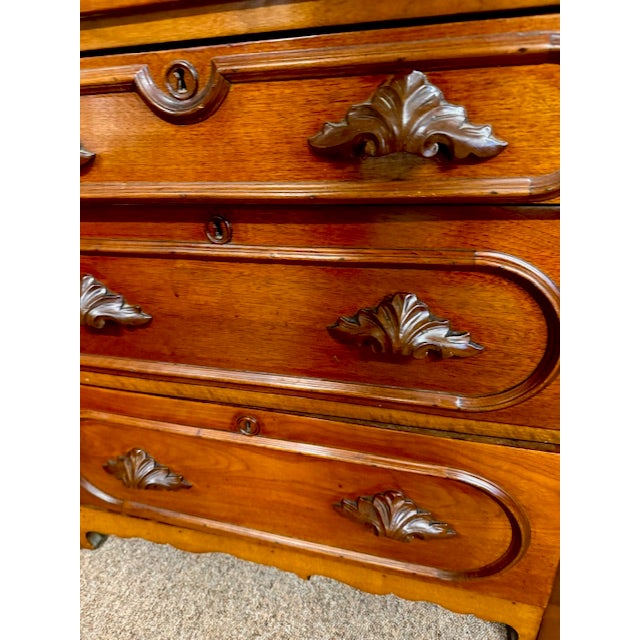 Nice antique Victorian walnut 3 drawer bachelors chest with applied racetrack molding and hand carved walnut drawer pulls....