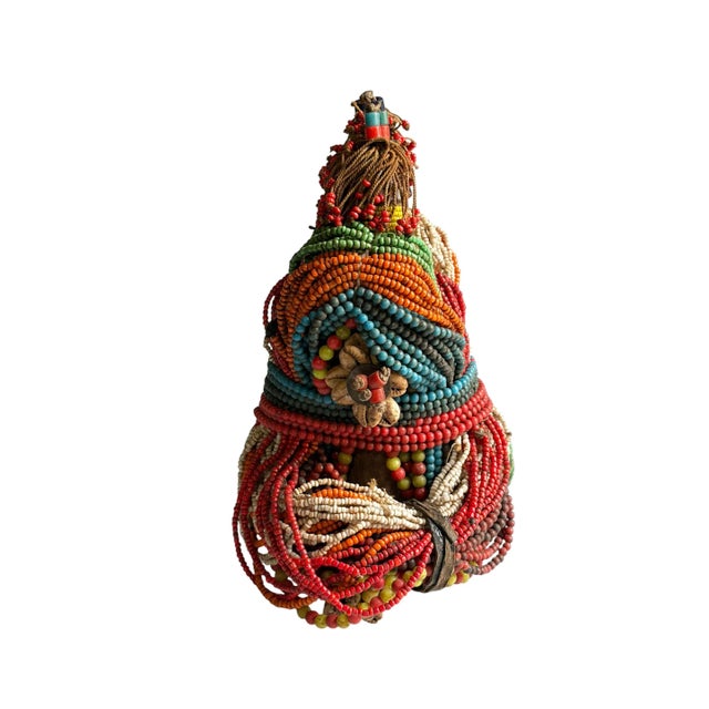 Superb vintage African Fali Namji twin fertility dolls adorned with multiple layers of trade glass beads leather strips...