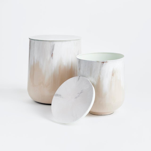 This modern pair of drum tables with removable tops are the perfect storage solution for the cozy space. In a clever use...