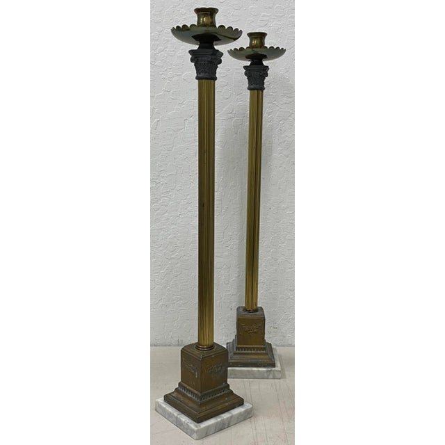 Early 20th Century Plate Brass Spelter Candle Holders Tall columns supported on Italian marble bases 5" x 5" at the base x...