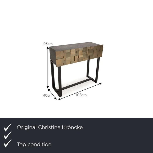 The Shape 13 sideboard by Chrstine Kröncke consists of a wooden body and stands on black feet. It is characterized by its...