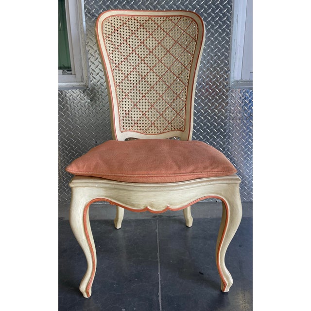 Set of six French Provincial / Louis XV style dining chairs featuring hand-finished frames with carved details, cane backs...