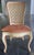 Set of six French Provincial / Louis XV style dining chairs featuring hand-finished frames with carved details, cane backs...