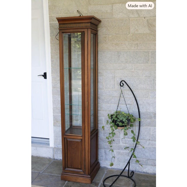 Exceptional Brandt solid cherry diminutive curio cabinet in the Chippendale style, featuring classic fretwork, crown...