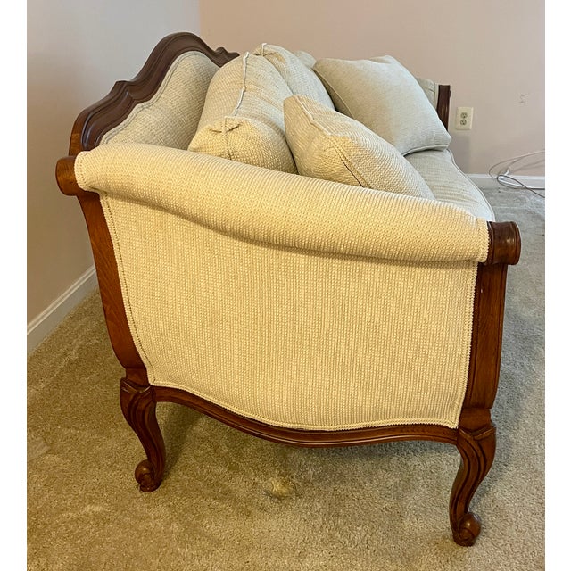 Ethan Allen Evette, single cushion settee in classic cream chunky chenille upholstery on dark wood frame featuring...