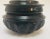 Burmese black and red lacquer offering vessel urn with compartment for storage. This round lacquer ware box from Burma is...