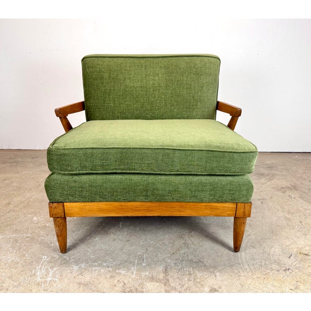A very rare 1950’s wide and low slung “Sophisticate” lounge chair in pecan wood by Tomlinson Furniture circa 1950’s. Now...