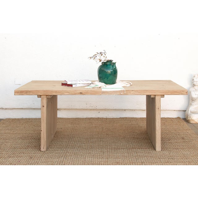 Some tables are built to disappear into a room. The Camargue isn't one of them, even at rest. It stands on two solid panel...