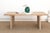Some tables are built to disappear into a room. The Camargue isn't one of them, even at rest. It stands on two solid panel...