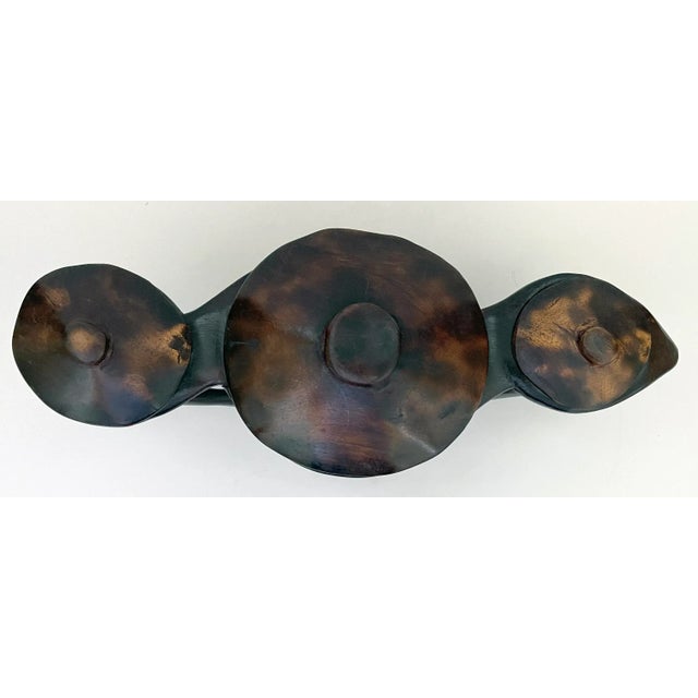 Hand-carved wooden 3 station serving vessel with 3 removable lids from Africa. Interior of center bowl is approximately...