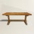 The best early 18th century French oak trestle table with a three-inch thick hand-hewn single-plank top resting on a hand-...