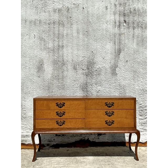 Discover unparalleled European elegance with this exquisite Vintage Italian Low Chest of Drawers, a testament to...