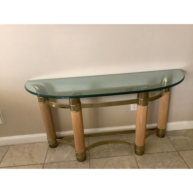 table was purchased in the 1970's at Macy's. Glass has no scratches on it and it is in good condition.