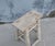 A charming vintage Chinese stool crafted from solid elmwood, dating to the first half of the 20th century. The thick,...