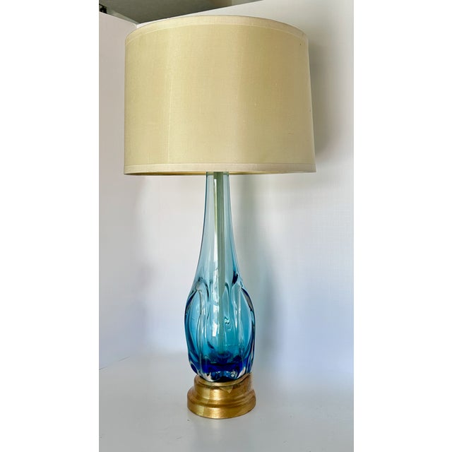 A single Murano Italian hand blown clear and blue glass organic shaped table lamp by Seguso. Mounted on metal gilt base....