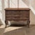 A Country French Régence style chest of drawers crafted in oak, with three serpentine drawers raised on graceful cabriole...