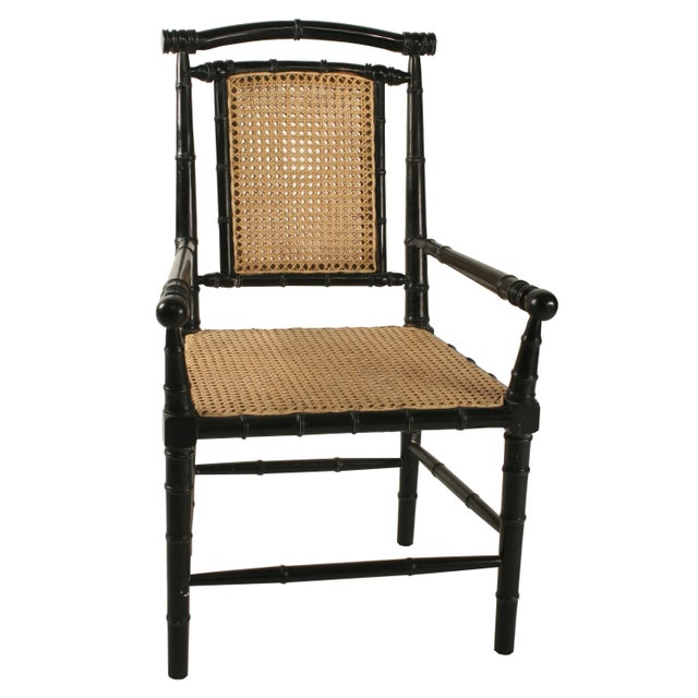 Hand-carved mahogany in a classic bamboo motif complements the bamboo seat and back of this classic colonial inspired side...