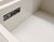 Vintage mirrored credenza by Grant & Sloan of Miami, Florida. It features a white laminate cabinet with four mirrored...