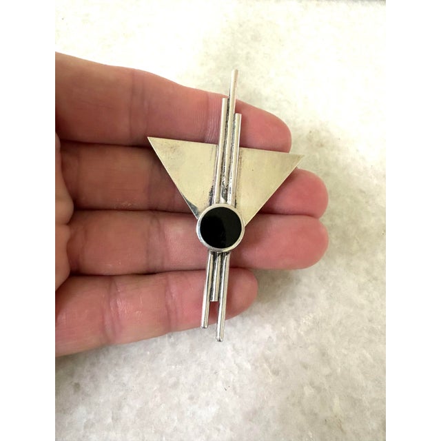 Sleek art deco sterling silver and onyx brooch