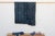 A masterwork of Malian textile heritage featuring deep indigo saturation and symbolic geometric motifs. Originating from...
