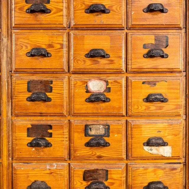 1940's faux wood workshop shelving - thirty drawers. Very early original french hardware shelving unit. Made in solid...