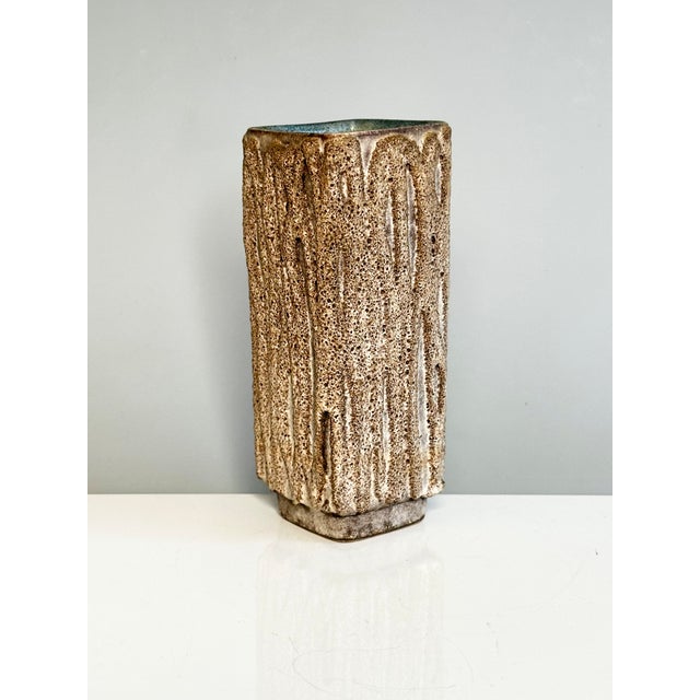 A square ceramic vase, with a base set off from the ground, dating from the 1960s and made by Strehla Keramik in Saxony,...