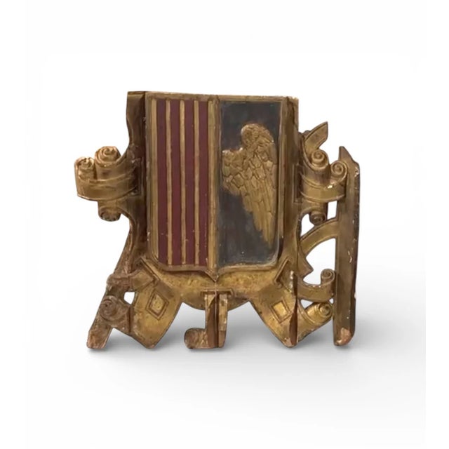 A powerful Spanish coat of arms from Catalonia, dating to the 18th century, hand-carved in wood with pronounced relief and...