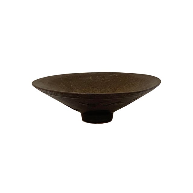 This exquisite Song Dynasty-style Jizhou ware tea bowl features a classic conical form, flaring elegantly from a narrow,...