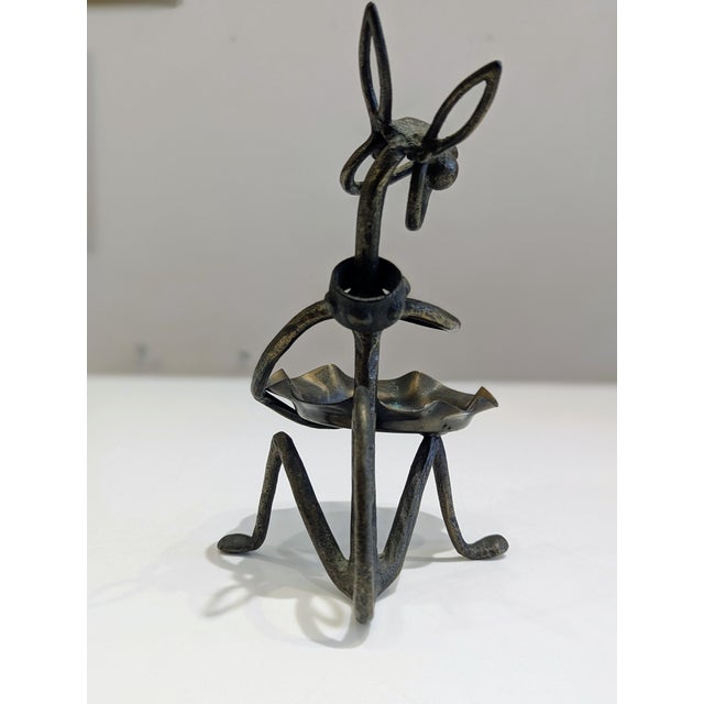 Wrought iron dog sculpture designed by John Josten, American, circa 1950s. Minimalist, line-driven form with an integrated...