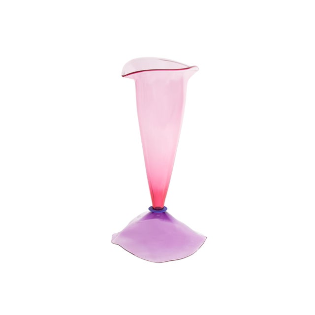 A 2004 art glass vase by the American glass artist Stephan Cox (born 1956). This delicate work is composed of a pink vase...