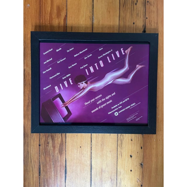 Rare vintage Warner video laminated poster - framed.