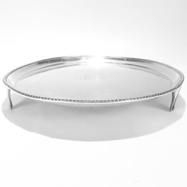 A fine early American signed salver. In coin silver. Marked I.T. Attributed to John Targee of New York. In the form of a...