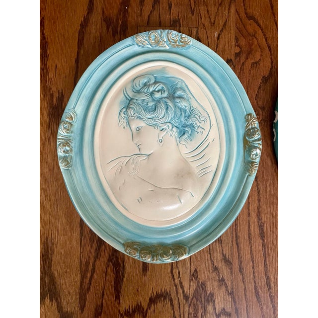 This unique Vintage Pair of Large French Bisque Oval Wall Plaques features a young woman. These plaques make a current,...