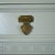 A Shangri La tall boy chest, its tall, narrow case stacked with drawers for efficient, elegant storage. The chinoiserie-...