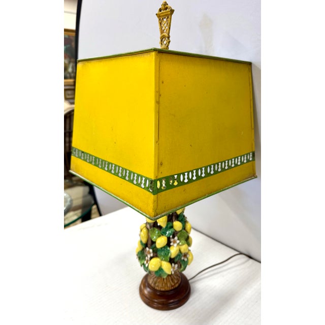 This delightful porcelain lemon topiary lamp has a hand-painted base adorned with a vibrant cascade of lemons, lush green...