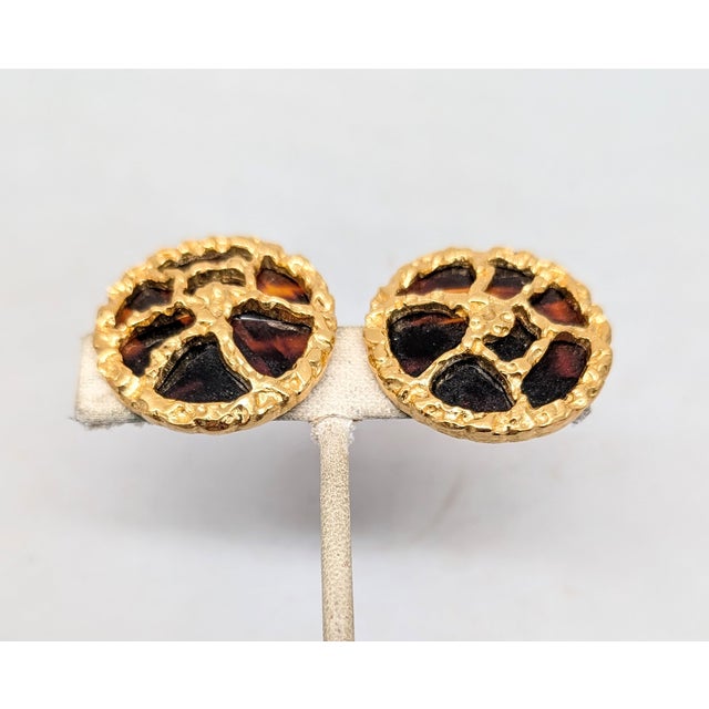 1970s round textured goldtone with faux-tortoise resin backing clip earrings. Marked crown "TRIFARI©" on the clips....