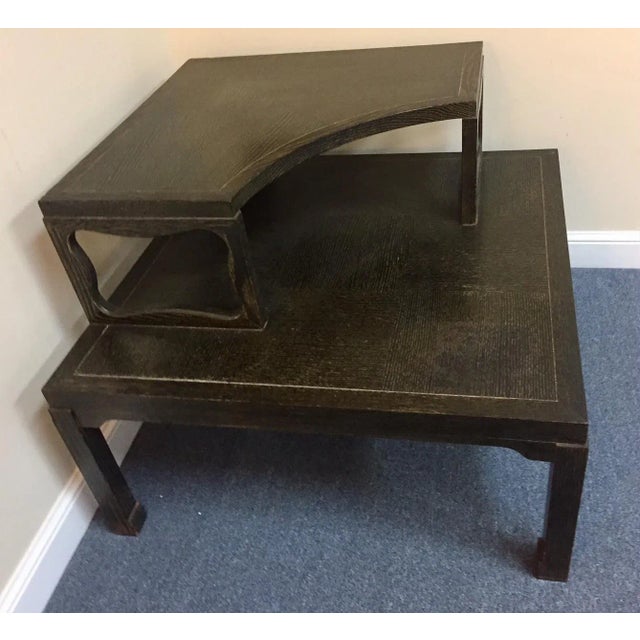 Timeless mid-century modern corner table from the 1970's. The piece is made of wood with a rich fumed oak finish. It has...