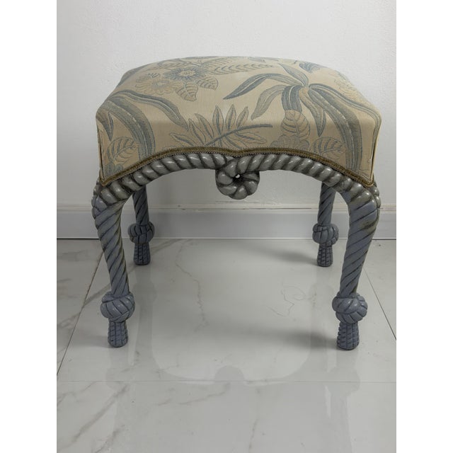 French Country style pouf with rope details, 1970 Gray in color, featuring sinuous legs and decorative woven rope details....
