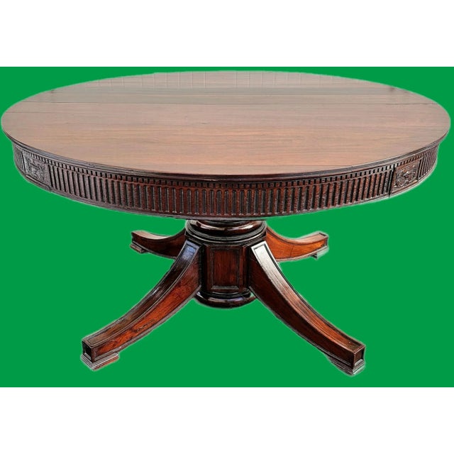 This stunning Antique 54" Round Pedestal Dining Table is a timeless and spacious dining item made of dark, richly-grained...