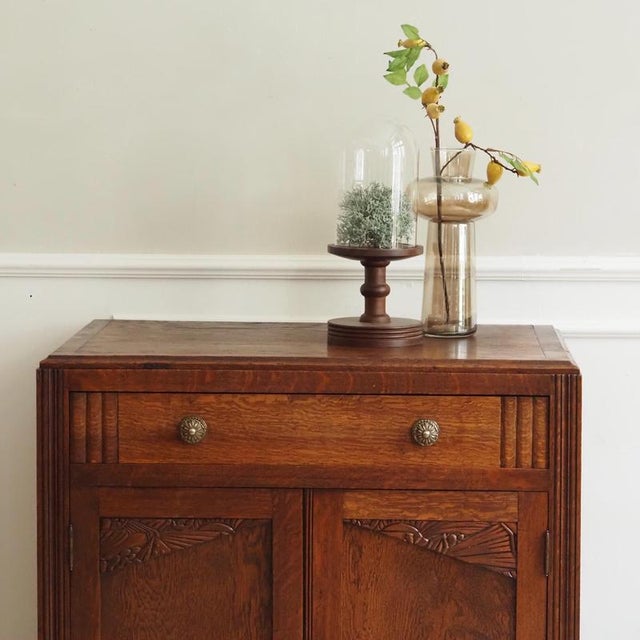 Small two-door cabinet with drawer, made of solid oak, Art Deco style, circa 1930, presumably France. The clearly...