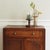 Small two-door cabinet with drawer, made of solid oak, Art Deco style, circa 1930, presumably France. The clearly...